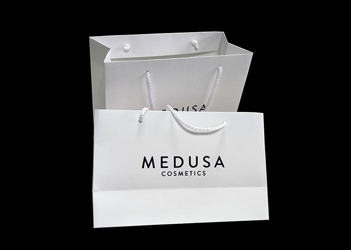 Напечатанное белой бумагой слоение причудливого изготовленного на заказ логотипа бумажных мешков лоснистое поставщик